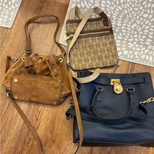 Three MK purses